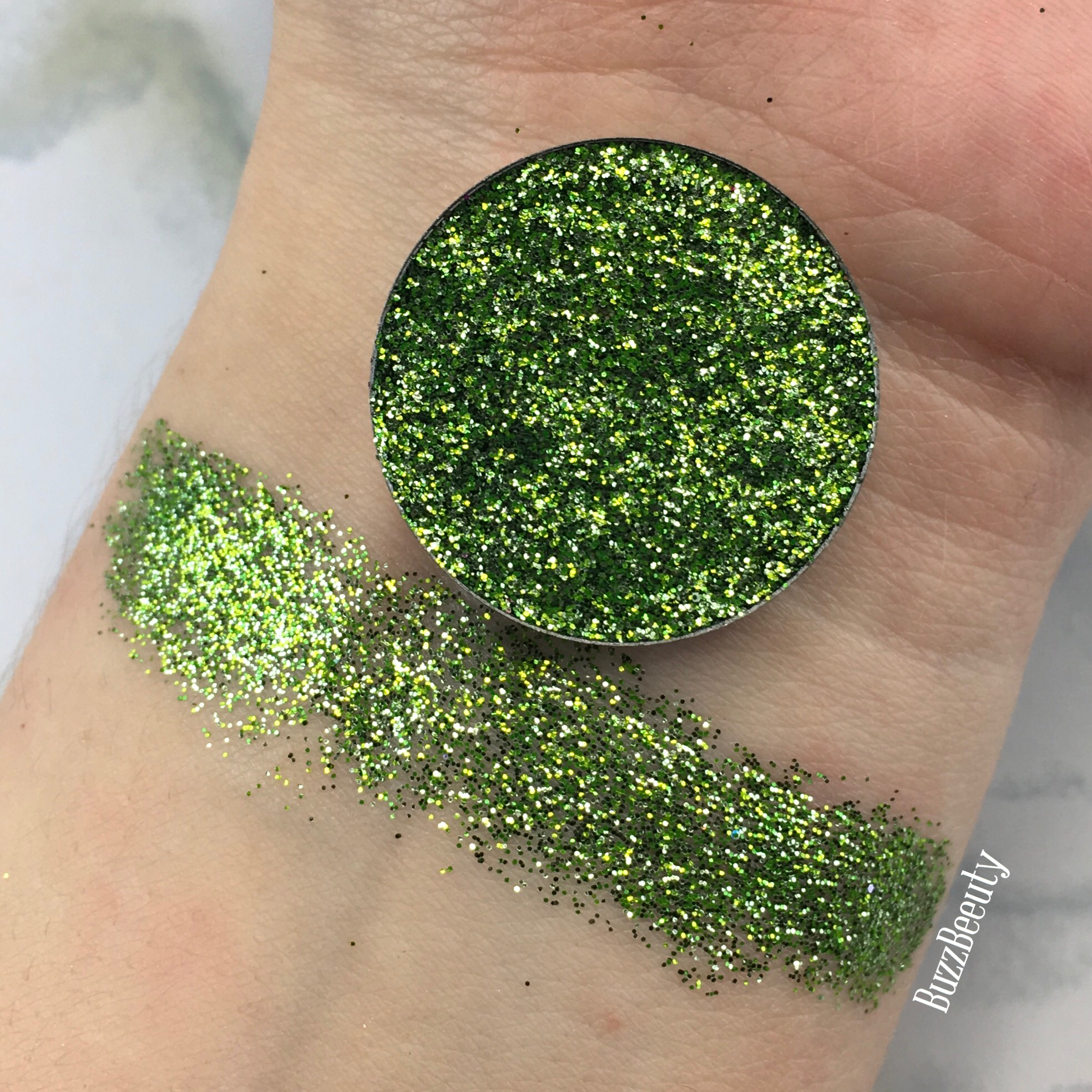 Dear Katie Brown Pressed Glitter Swatch in the shade Mash Up. True dark green with lime green glitters.