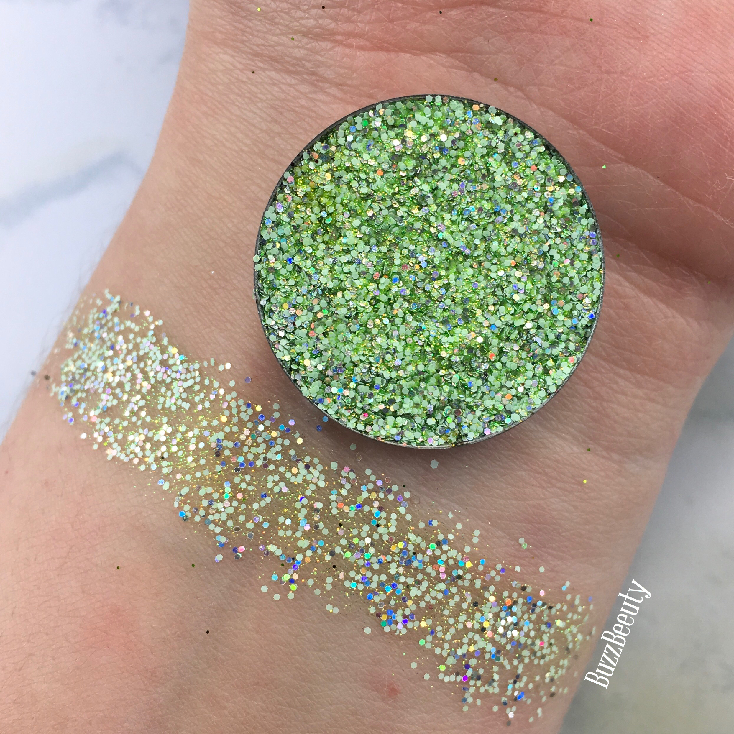 Dear Katie Brown Pressed Glitter Swatch in the shade Salty. Lime green with holographic glitters.