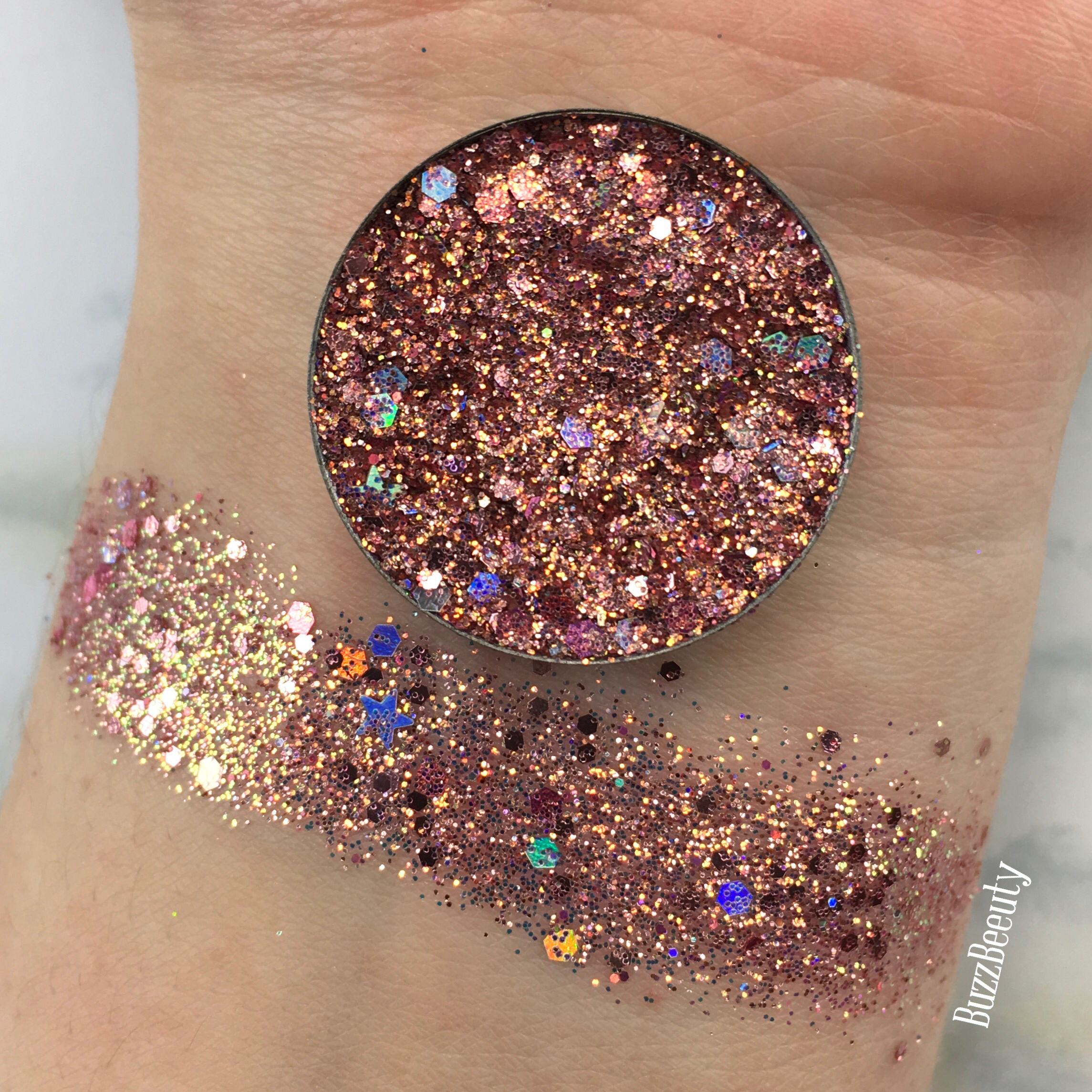 Dear Katie Brown Pressed Glitter Swatch in Spiritual Rebllion. Copper/Rose Gold base with chunky holographic glitters. 