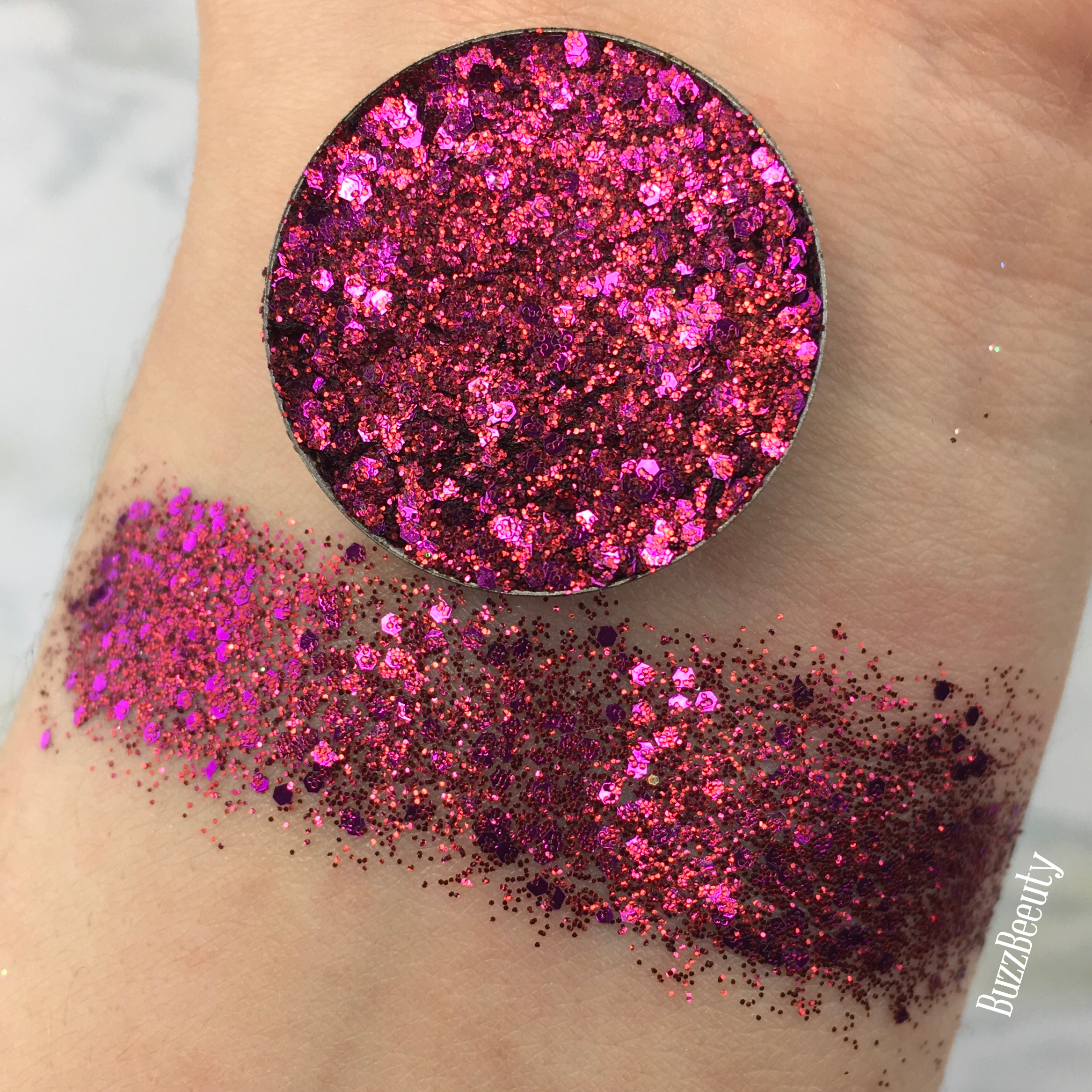 Dear Katie Brown Pressed Glitter Swatch in Tracy. Bright fushia Pink with purple glitters.